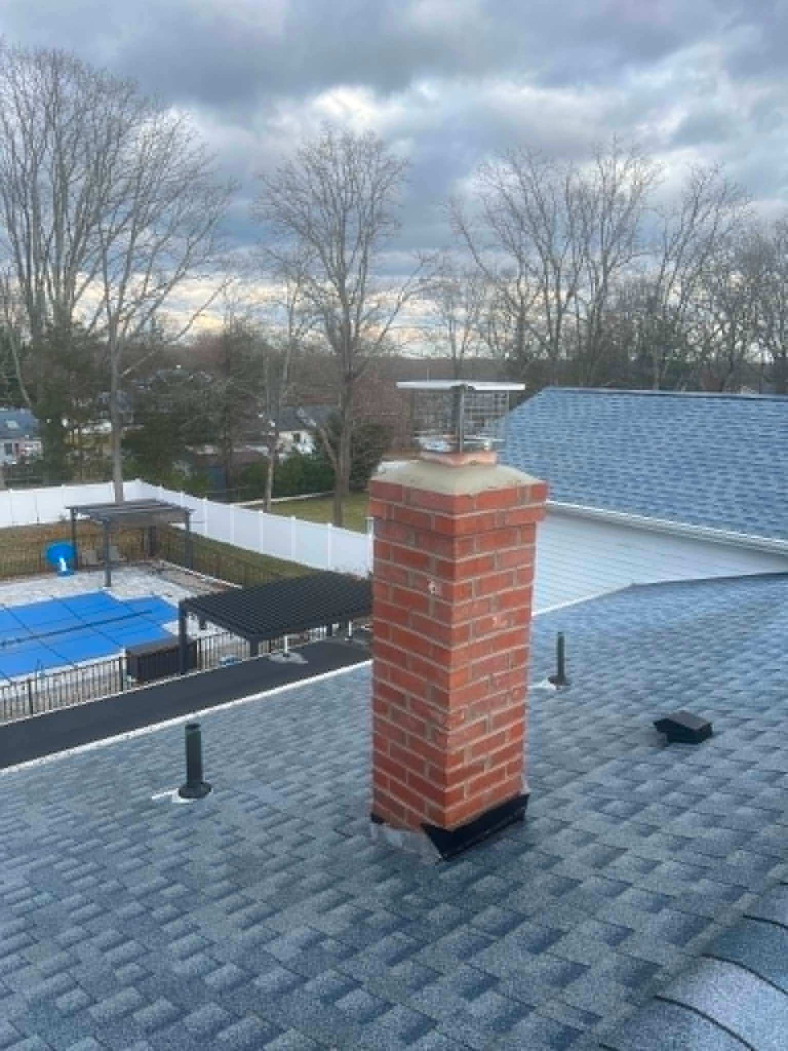 Stainless steel chimney cap installation — Legacy Peak Roofing & Construction, New Jersey