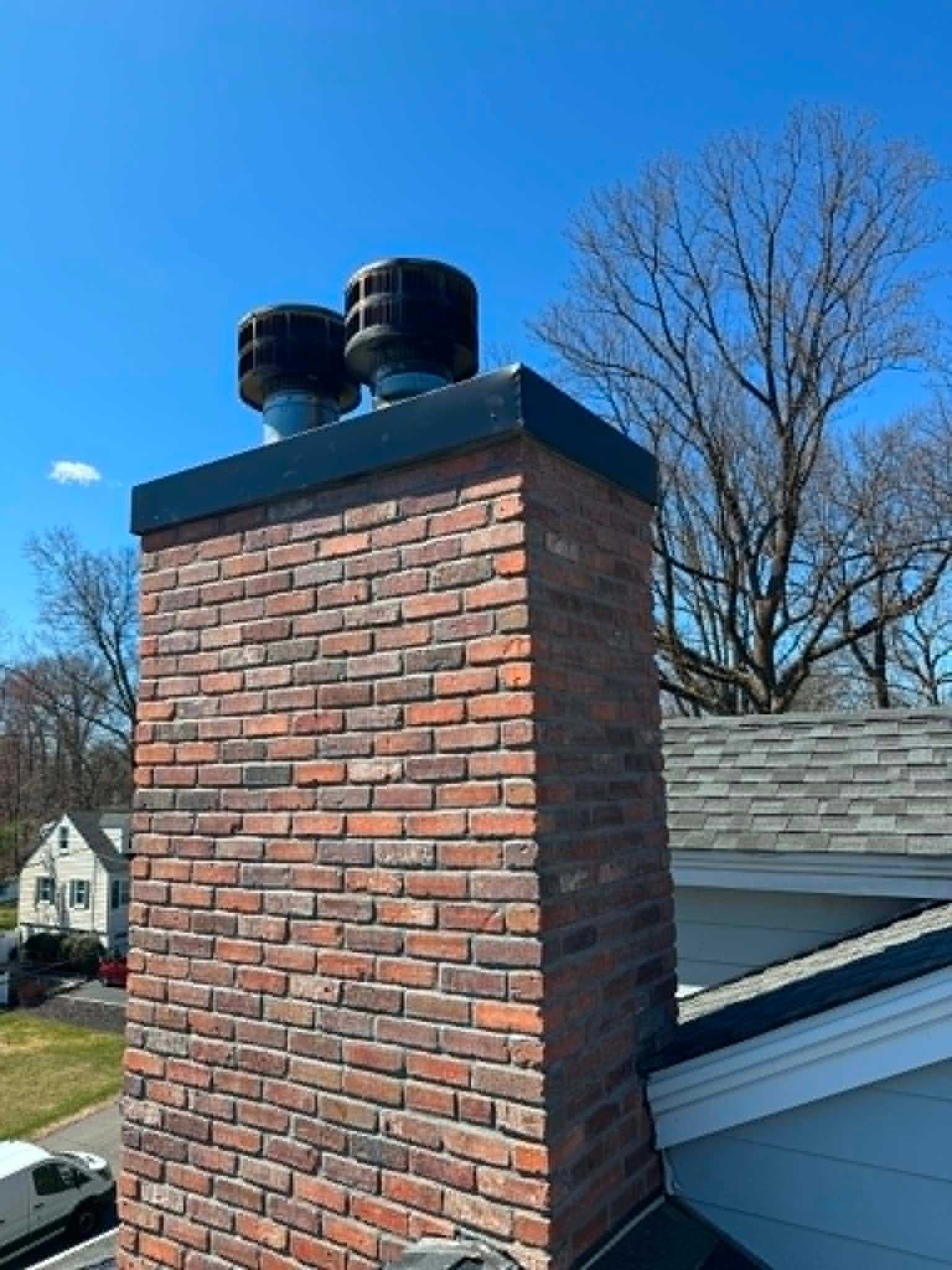 Chimney liner and flue cap installation by Legacy Peak Roofing & Construction
