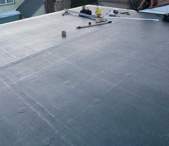 Commercial flat roof installation by Legacy Peak Roofing & Construction