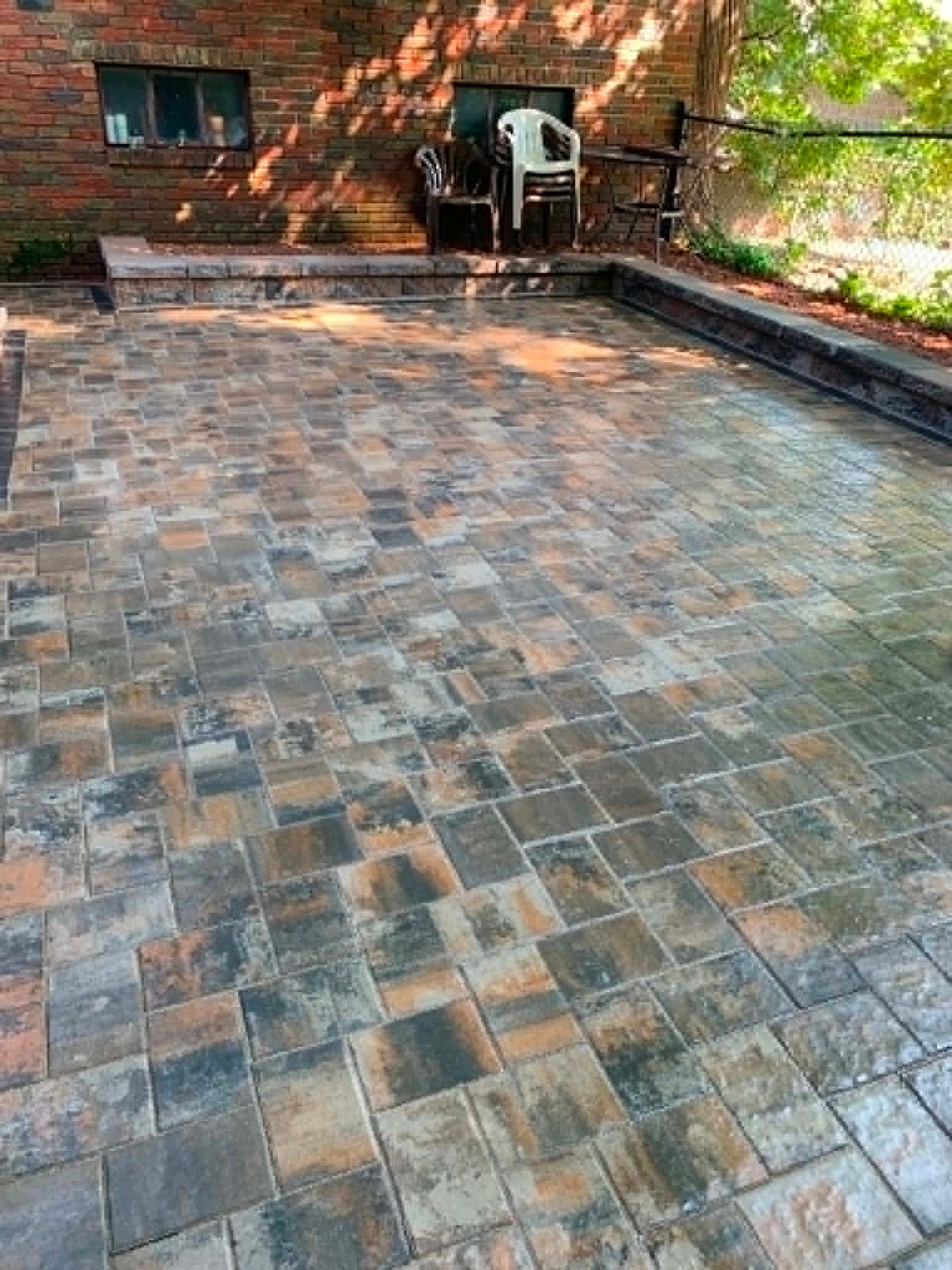 Paver patio with built-in sitting wall, New Jersey backyard