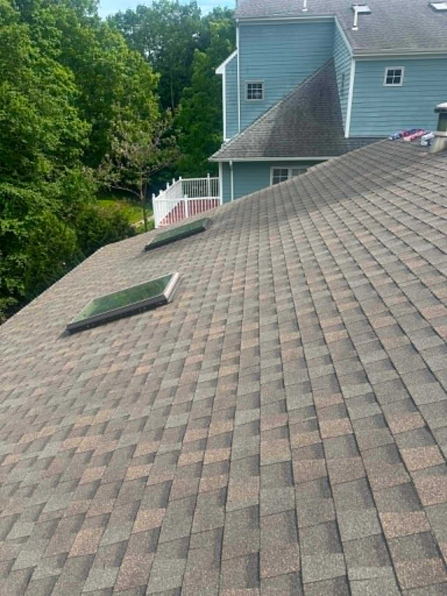 Skylight installation on a shingle roof by Legacy Peak Roofing & Construction